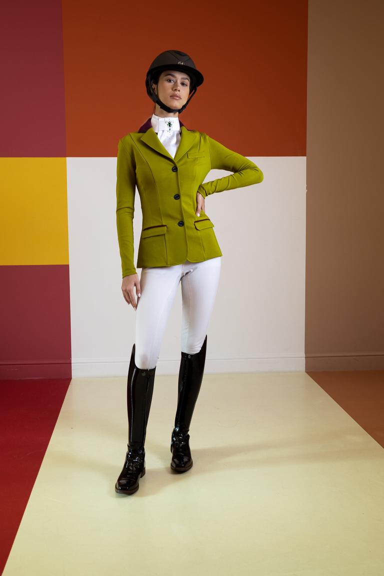 Rider in an olive competition jacket with burgundy trim and white breeches
