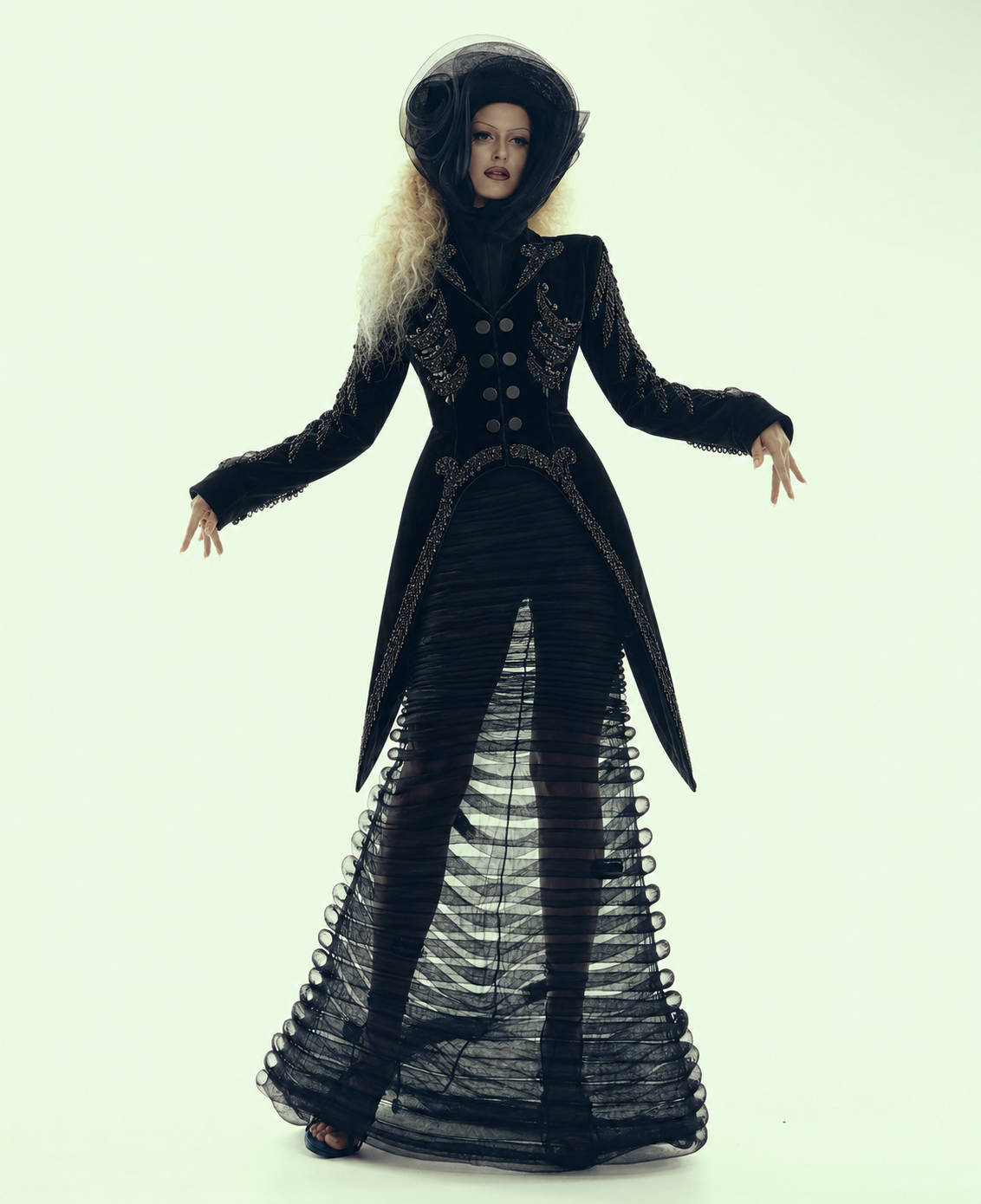 Couture black velvet tailcoat with hand embroidery and tulle skirt