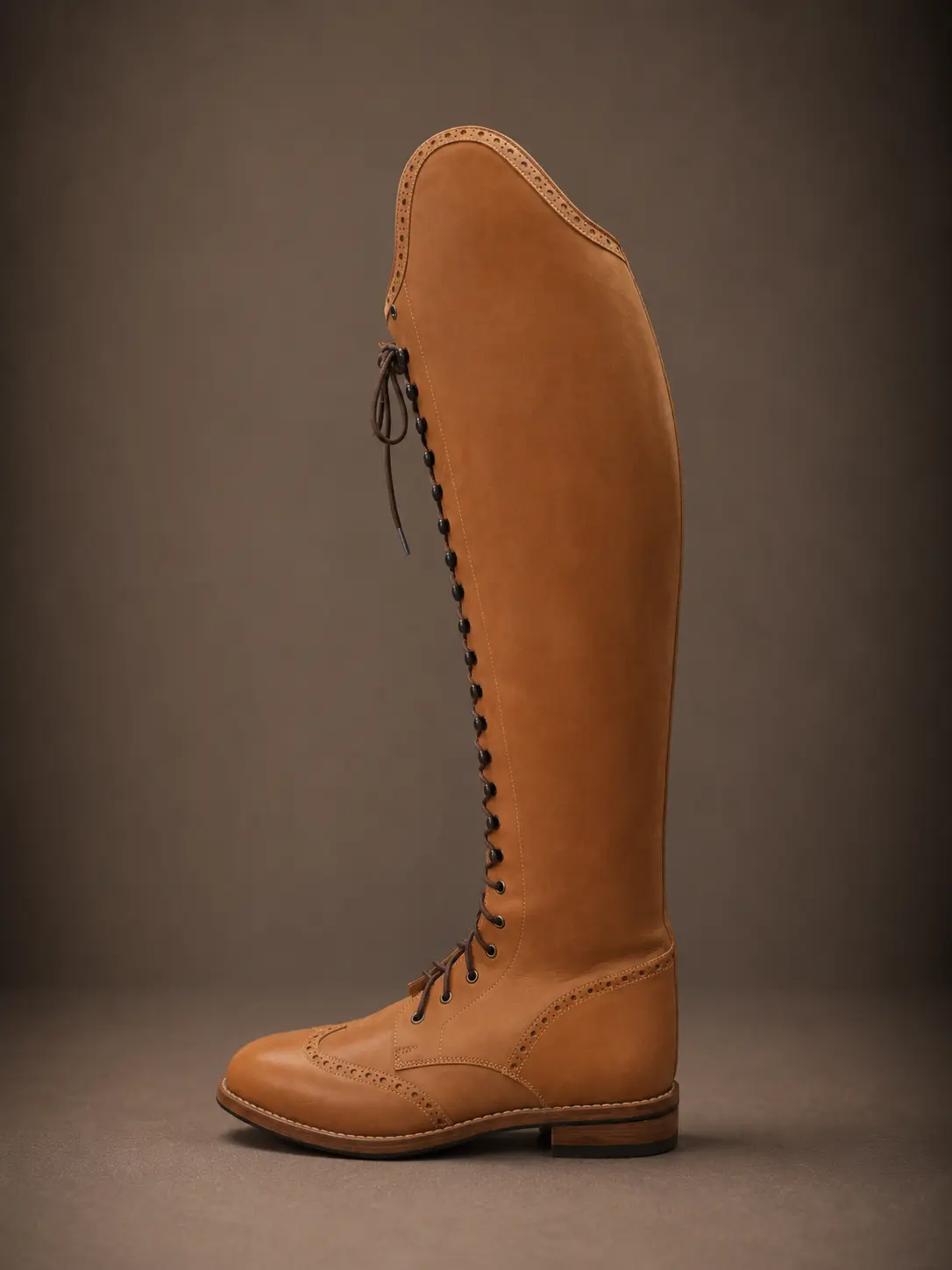 Tan nubuck laced field boot with brogue toe cap